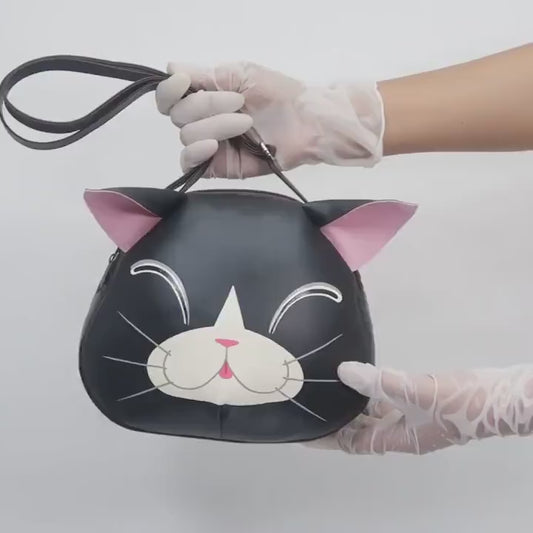 Smiling Black cat crossbody bag,hand painted bag,this compact synthetic leather sling bag, for carrying mobile phones and other essentials.